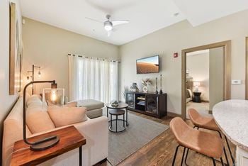 A living room with a couch and a table